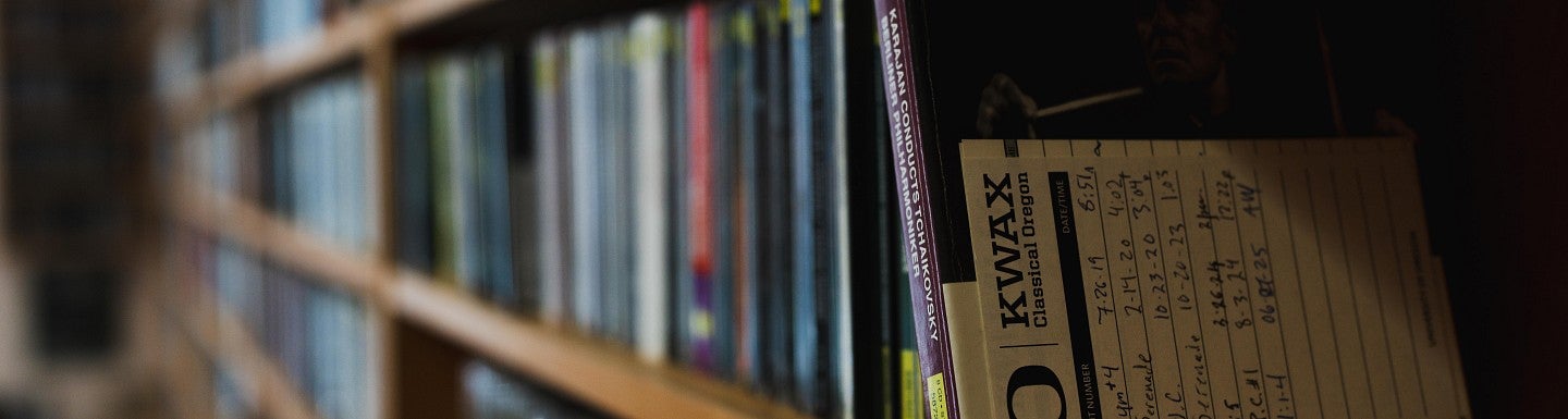 Row of compact discs on a shelf
