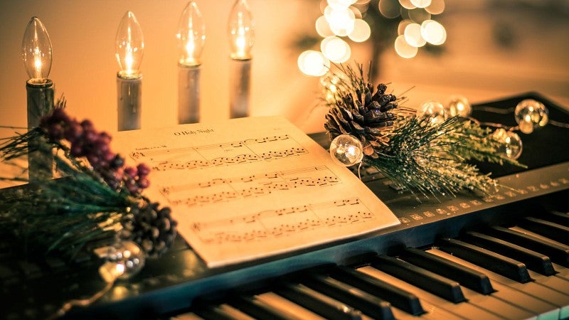 candles and music at a keyboard 